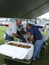 Wrapping up some whole chickens in aluminum foil.