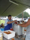 Brother Marvin Epting prepares his special BBQ sauce.