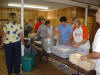 The line forms for assembling chicken plates.
