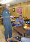 Brother Ronnie and Brother Walter put the finishing touches on a few baskets.