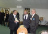 Members of the head table go over the evening's events