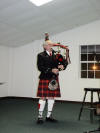 The Reverend Ed Wilkes bids us farewell with the BIG pipes.