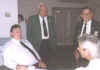 Bernie Schmitt (sitting) spins a tall tale for the Grand Commander Charles Albertson and other Sir Knights that stroll by
